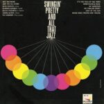 Pochette de jazz noire, titre blanc et cercle d’anneaux colorés
